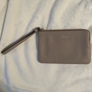 slightly used tan Corner Zip Wristlet